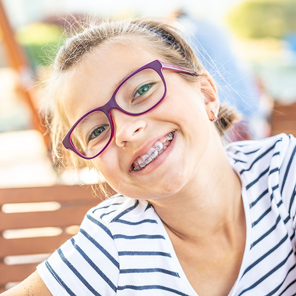 Girl with traditional dental braces